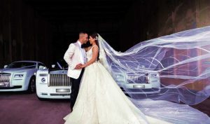 bride & groom with Rolls-Royce wedding cars