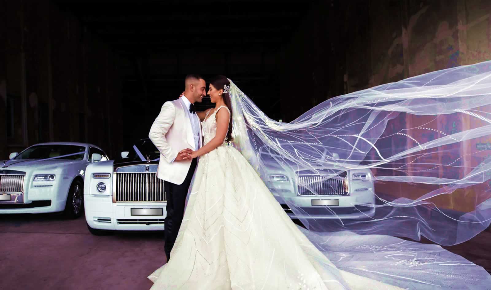 bride & groom with Rolls-Royce wedding cars