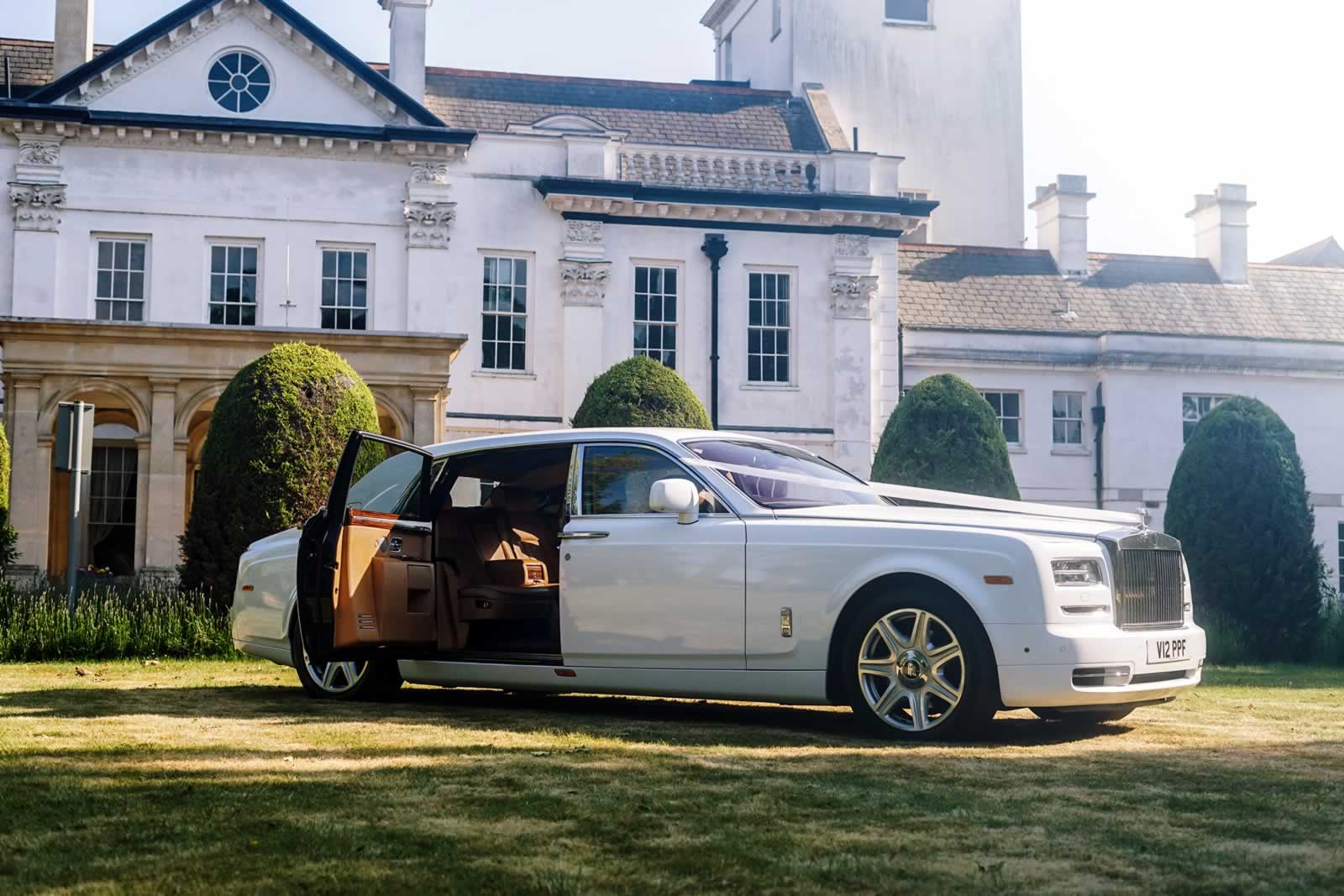 Rolls-Royce Phantom VII Series 2 EWB with rear coach door open and wedding car ribbons