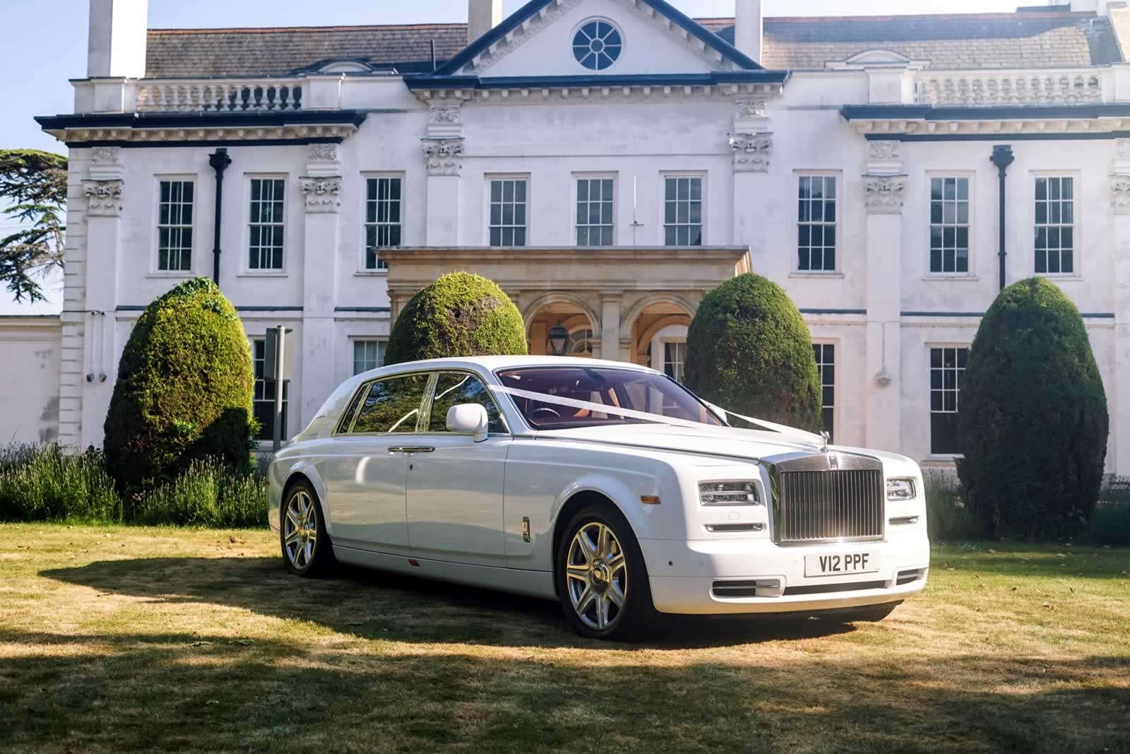 Rolls-Royce Phantom VII Series 2 EWB 3/4 front with wedding car ribbons