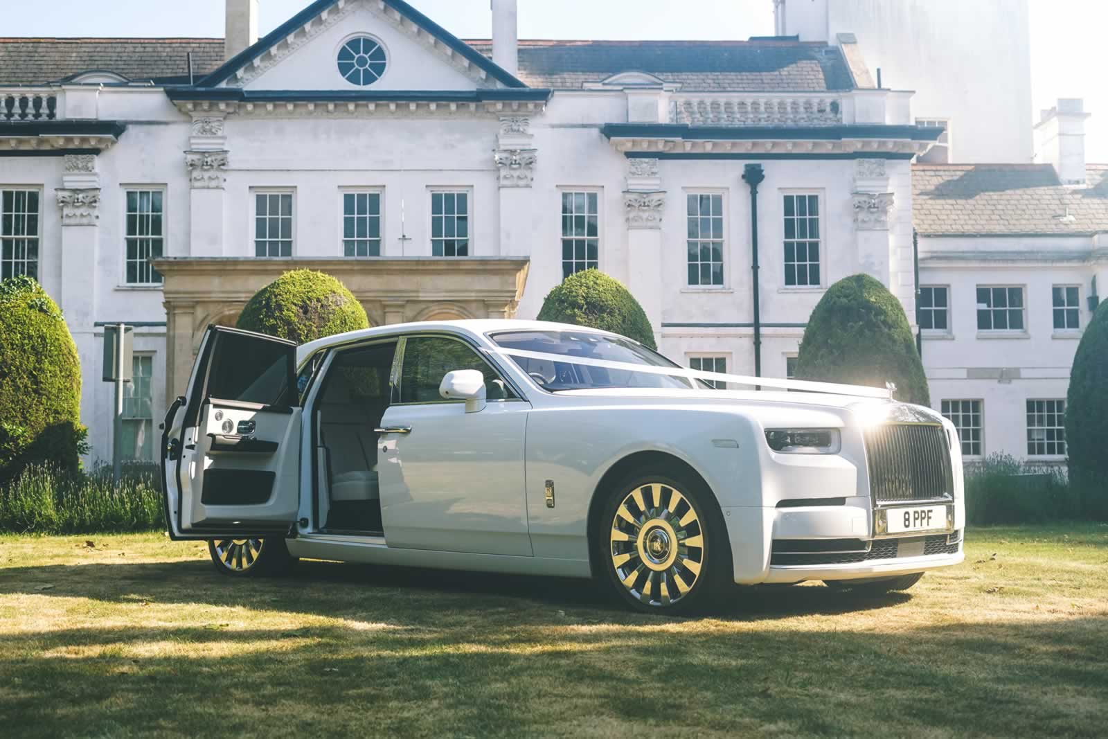 Rolls-Royce Phantom VIII (Eight) open coach door with wedding car ribbons on bonnet