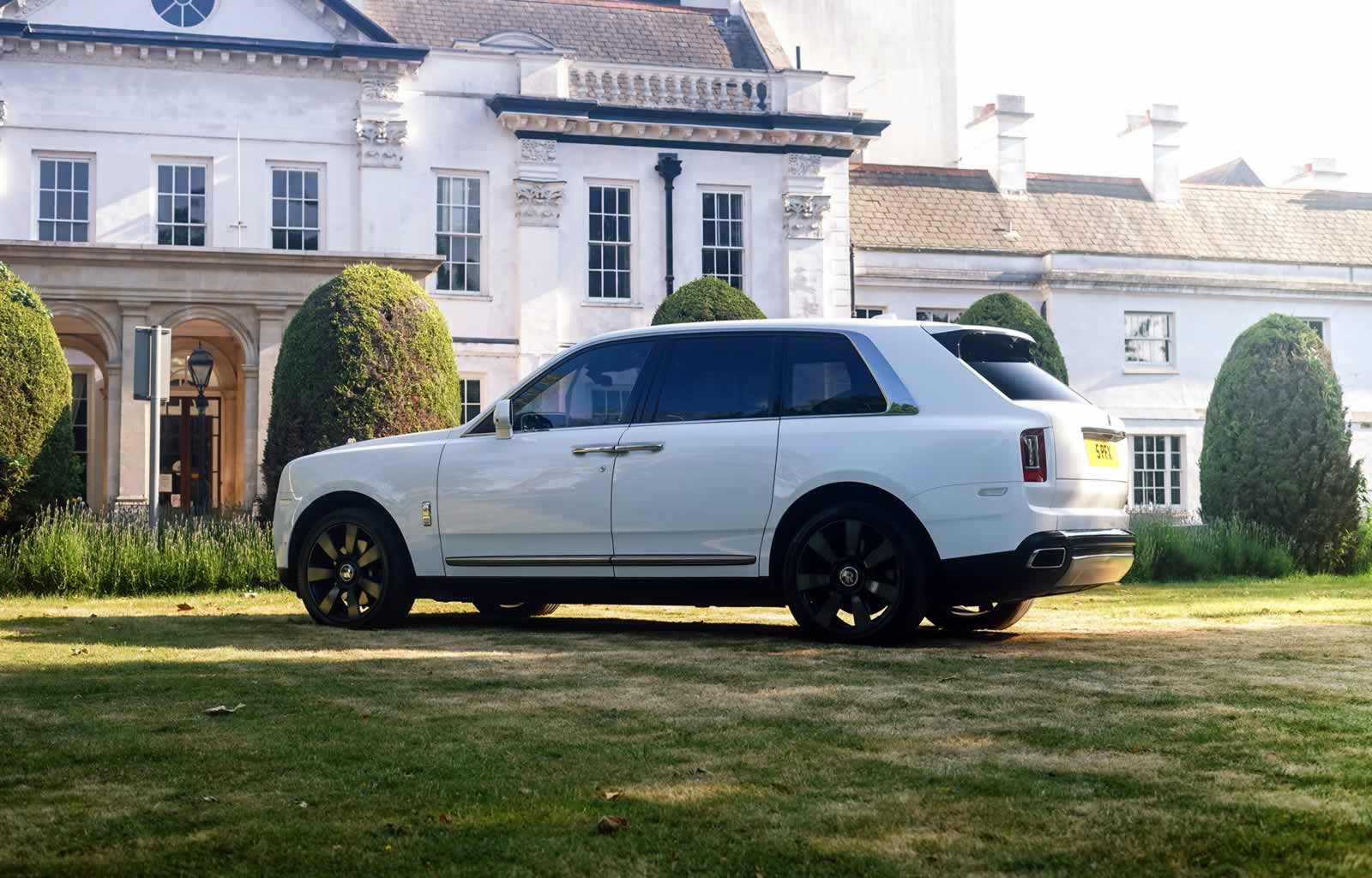 white Rolls-Royce Cullinan rear 3/4 view