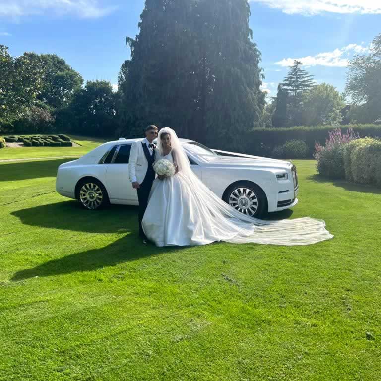 Bride & Groom pictured with our own Rolls-Royce Phantom 8 model at a recent wedding in Essex.